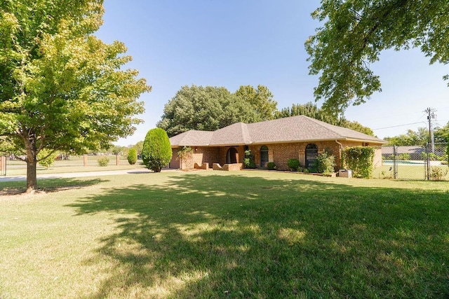 ranch-style house with a front yard