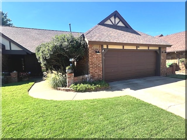 view of front facade with a garage and a front yard