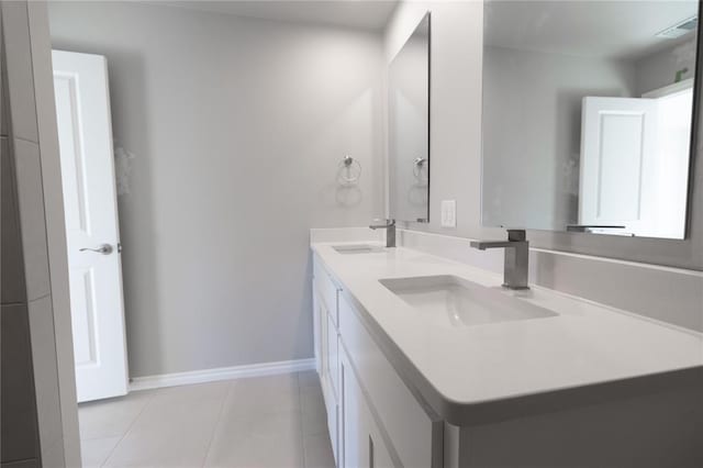 bathroom with vanity and tile patterned floors