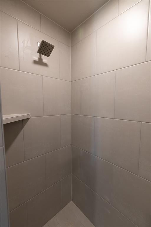 bathroom with tiled shower