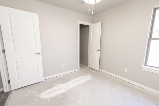 unfurnished bedroom with concrete floors