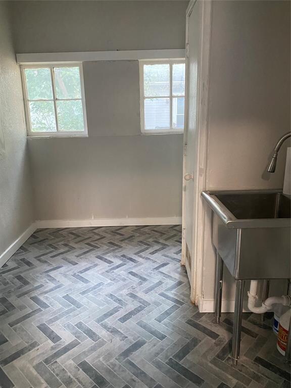 laundry room with sink and a wealth of natural light