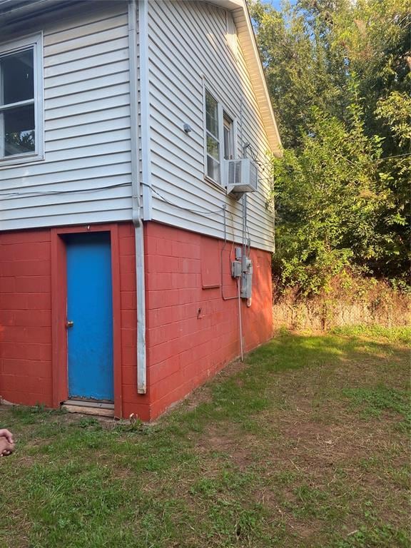 view of home's exterior featuring a yard