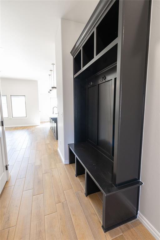 mudroom with light hardwood / wood-style flooring