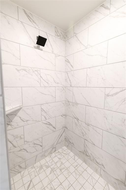 bathroom with tiled shower