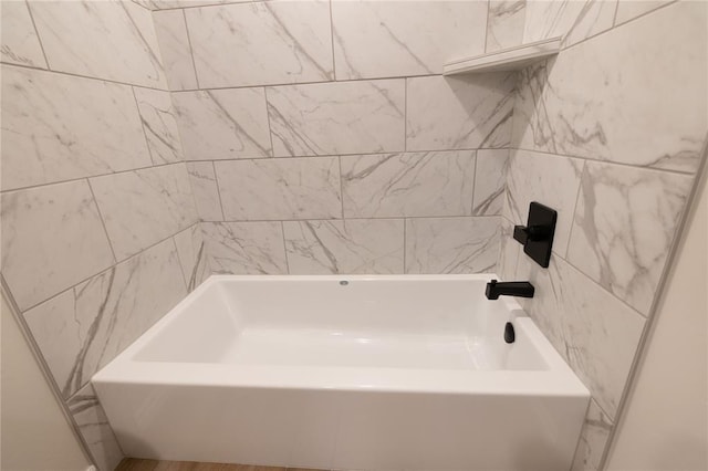 bathroom featuring a tub to relax in