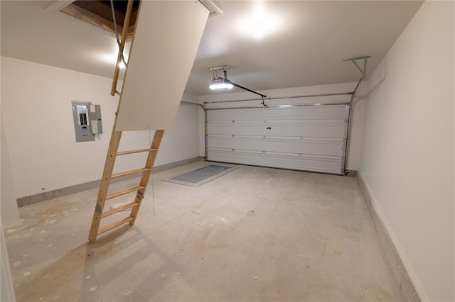 garage with a garage door opener and electric panel