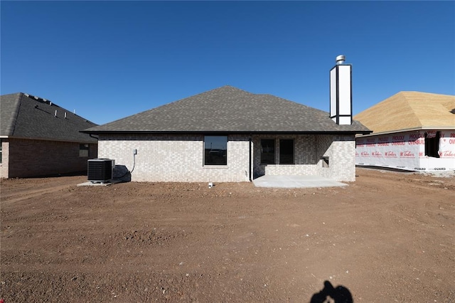 rear view of house with cooling unit and a patio area