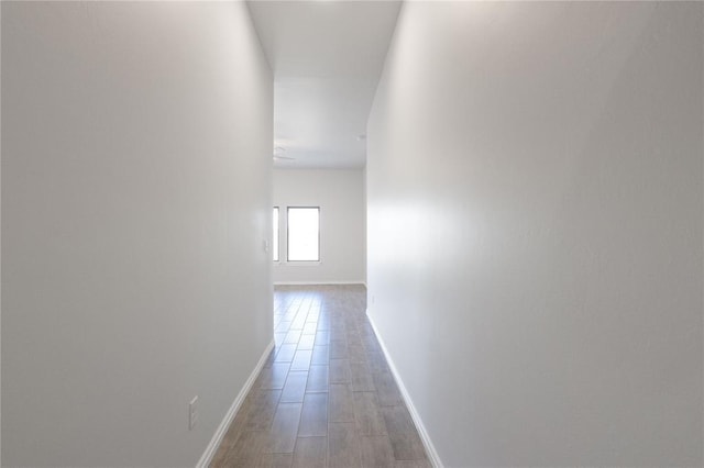 hallway featuring baseboards