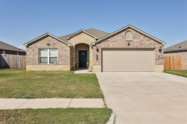 view of front of house with a garage and a front yard