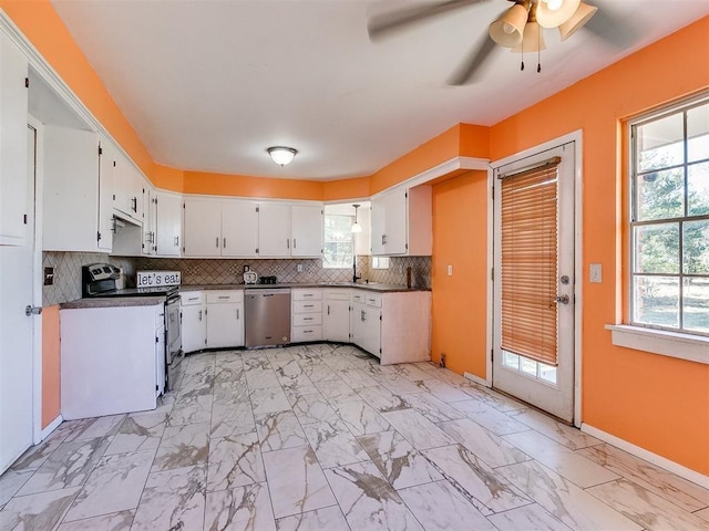 kitchen with electric range oven, tasteful backsplash, stainless steel dishwasher, plenty of natural light, and white cabinets