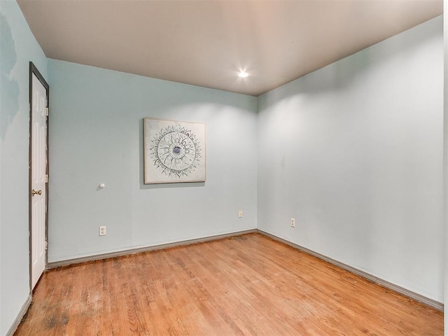 spare room featuring light hardwood / wood-style floors