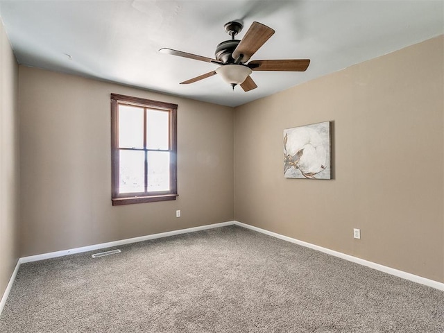 carpeted empty room with ceiling fan