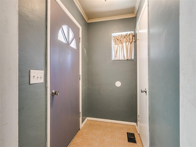 entryway with plenty of natural light and ornamental molding