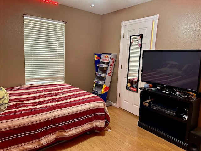 bedroom with light wood-type flooring