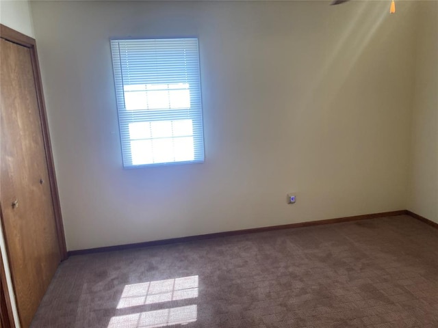 unfurnished room with carpet flooring