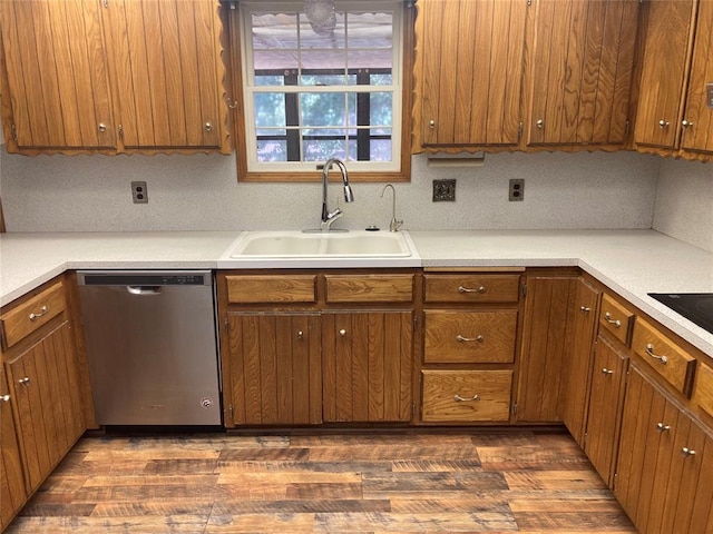 kitchen featuring dishwasher, dark hardwood / wood-style flooring, decorative backsplash, and sink