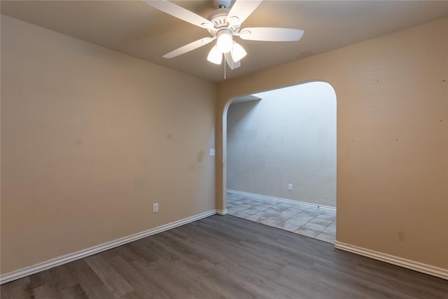 unfurnished room with hardwood / wood-style floors and ceiling fan