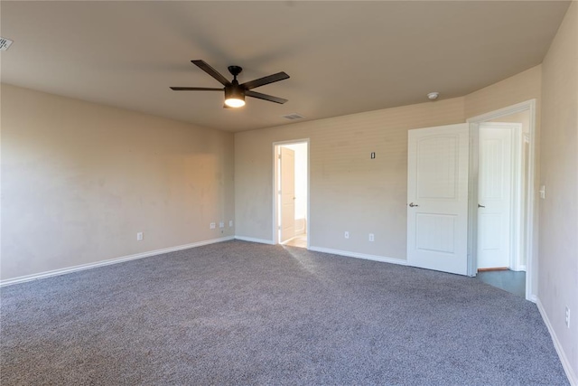 carpeted spare room with ceiling fan