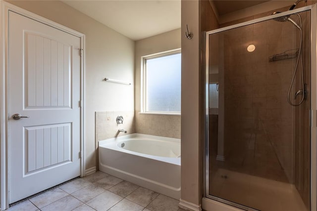 bathroom with tile patterned floors and separate shower and tub