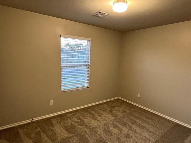 empty room featuring carpet floors