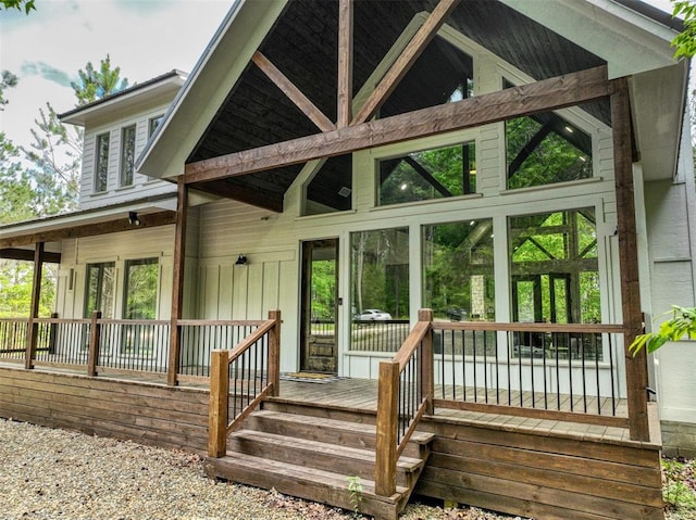 rear view of house featuring a porch