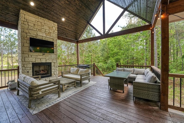 deck featuring an outdoor living space with a fireplace and a gazebo