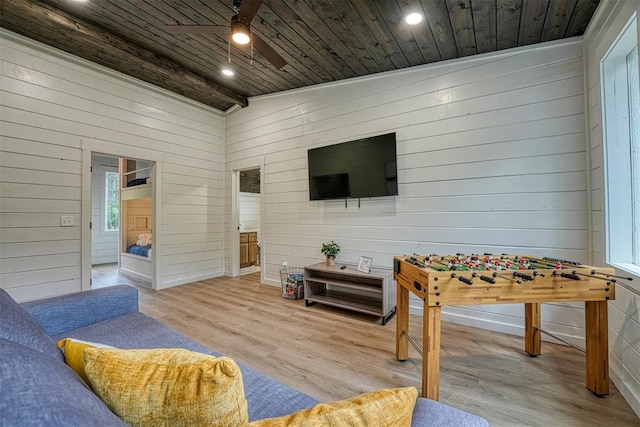 interior space with light hardwood / wood-style flooring, vaulted ceiling, and wooden ceiling