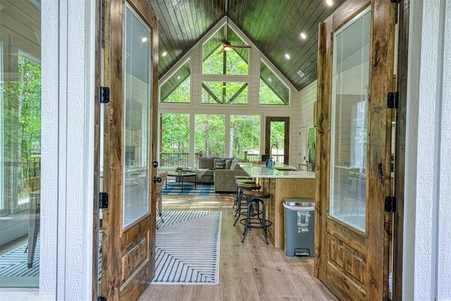 office area with french doors, wood ceiling, sink, light hardwood / wood-style flooring, and lofted ceiling