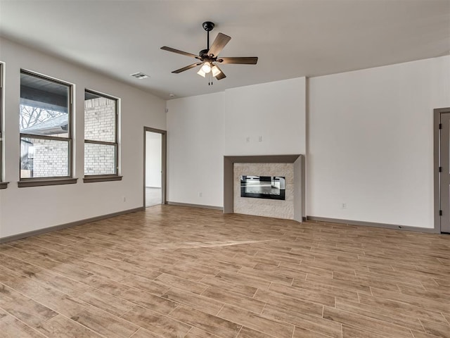 unfurnished living room featuring ceiling fan