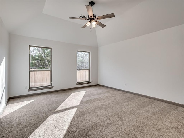 carpeted spare room with lofted ceiling and ceiling fan