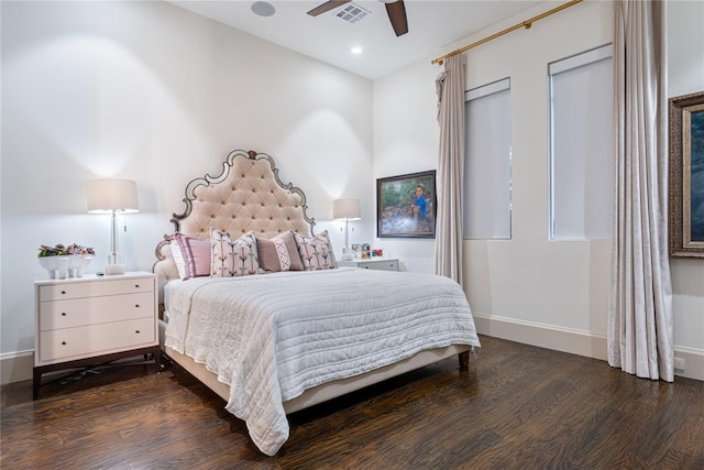 bedroom with ceiling fan and dark wood-type flooring