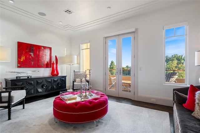 sitting room with french doors and hardwood / wood-style flooring