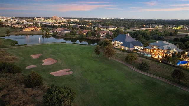 aerial view at dusk with a water view