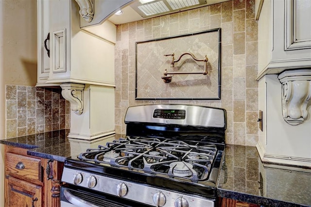 kitchen with backsplash and stainless steel gas range