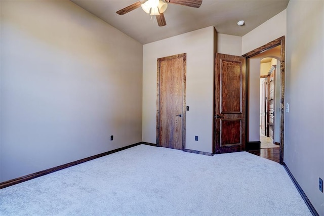 unfurnished bedroom featuring carpet and ceiling fan