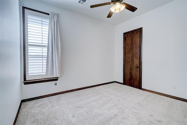 spare room with carpet flooring and ceiling fan