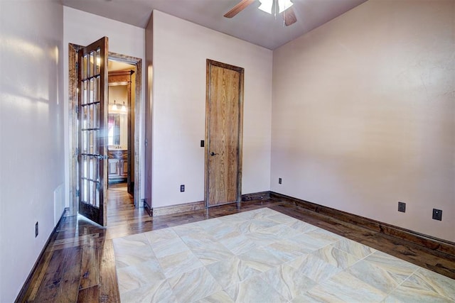 unfurnished bedroom with hardwood / wood-style floors, french doors, and ceiling fan