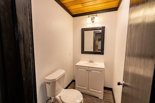 bathroom with toilet, vanity, wood ceiling, and wood-type flooring