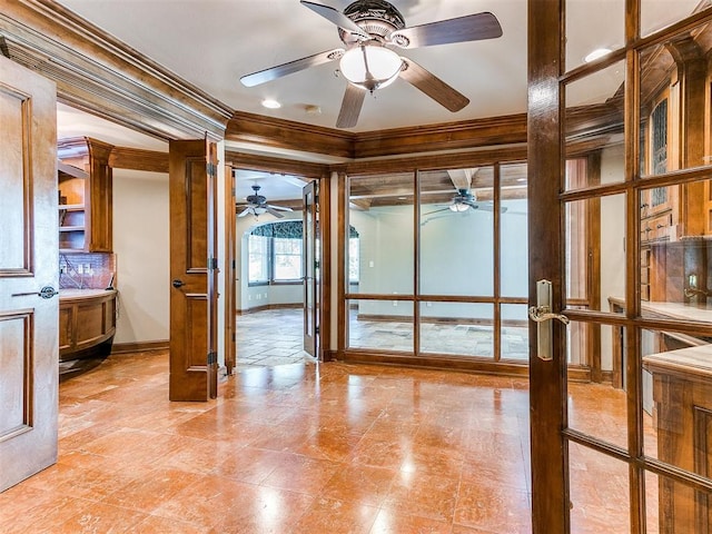 interior space with ornamental molding and french doors