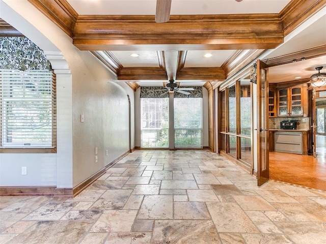 interior space featuring beamed ceiling and ceiling fan