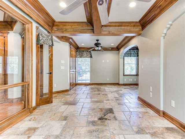 spare room featuring ornamental molding and a healthy amount of sunlight