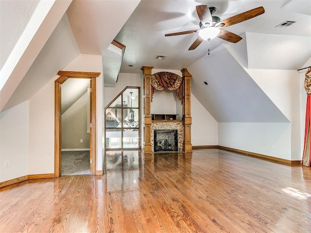 additional living space featuring light hardwood / wood-style flooring, ceiling fan, and lofted ceiling