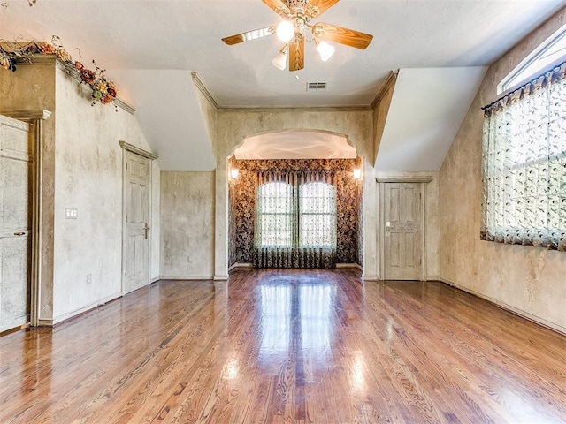 interior space featuring hardwood / wood-style floors, vaulted ceiling, and ceiling fan