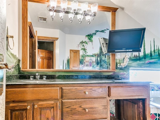 bathroom with a bath and vanity