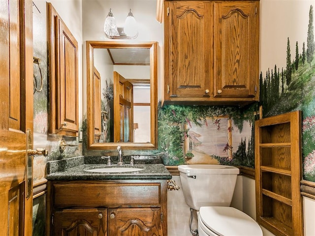 bathroom with vanity, backsplash, and toilet