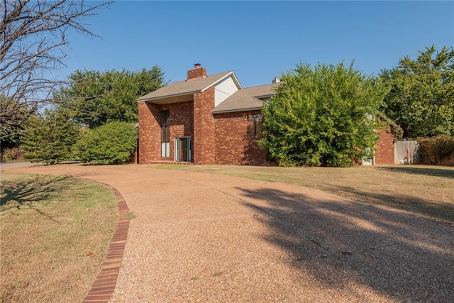 view of home's exterior featuring a yard