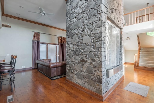 interior space featuring hardwood / wood-style floors and ornamental molding