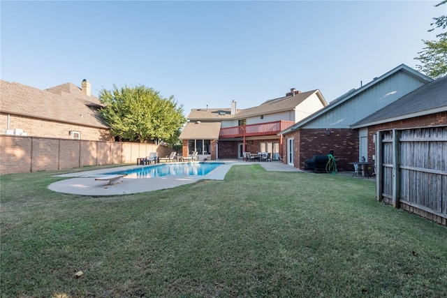 view of yard with a fenced in pool and a patio area