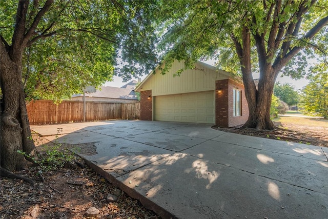 view of side of home with a garage